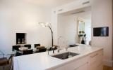brownstone, contemporary, light, white, fireplace, kitchen, deck, 